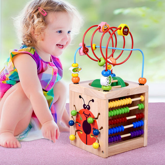 Wooden children's puzzle beetle surrounded by large beads