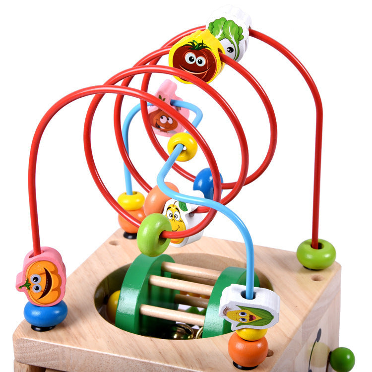 Wooden children's puzzle beetle surrounded by large beads